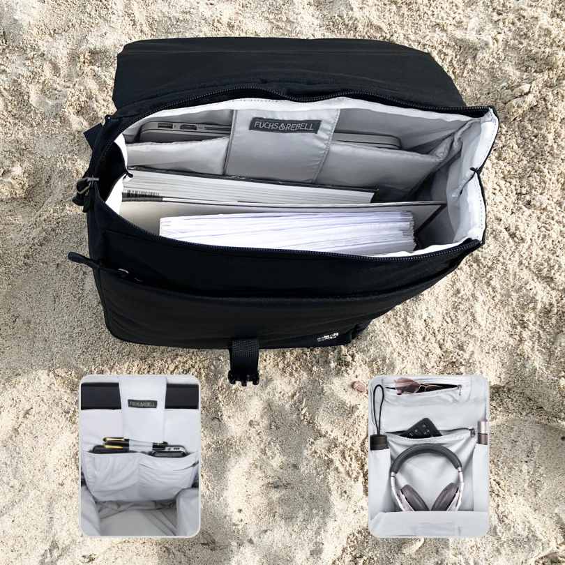 Strandfoto von der Innenansicht des schwarzen FUCHS und REBELL MATS Daypack Rucksacks mit vielen praktischen Faechern.